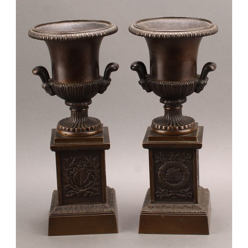 2081 - A pair of 19th century brown patinated bronze campana library urns, in the Grand Tour taste, each ba... 