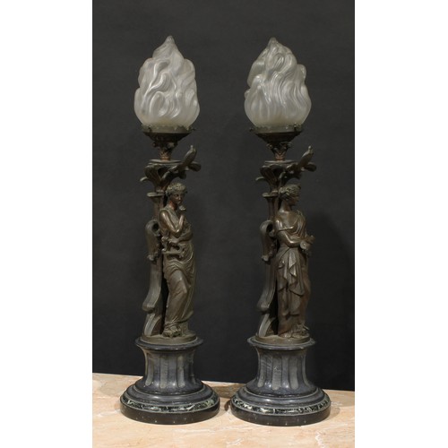 2084 - A pair of French brown patinated bronze figural table lamps, cast as personifications of music and l... 