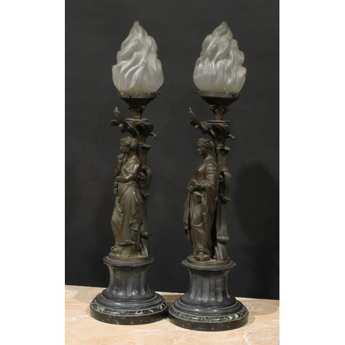 2084 - A pair of French brown patinated bronze figural table lamps, cast as personifications of music and l... 