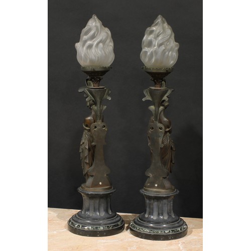 2084 - A pair of French brown patinated bronze figural table lamps, cast as personifications of music and l... 