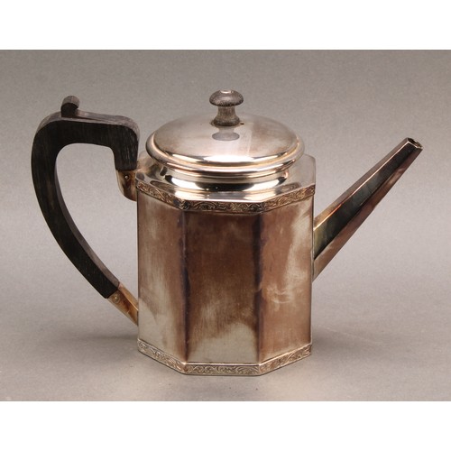 735 - A Continental silver octagonal teapot and cover, the borders banded with foliate scrolls, ebony hand... 