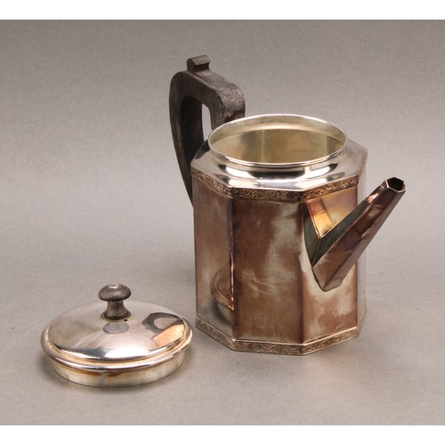 735 - A Continental silver octagonal teapot and cover, the borders banded with foliate scrolls, ebony hand... 