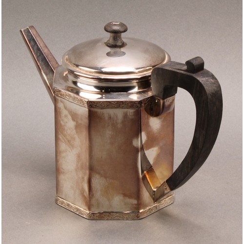 735 - A Continental silver octagonal teapot and cover, the borders banded with foliate scrolls, ebony hand... 