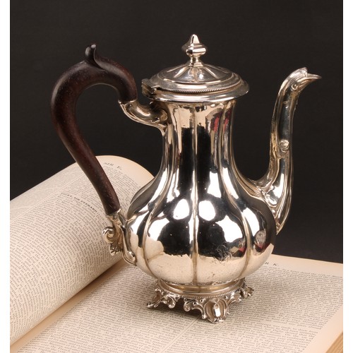 747 - A French silver fluted baluster teapot, hinged cover with knop finial, the spout chased with foliage... 