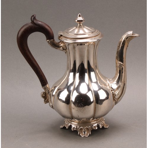 747 - A French silver fluted baluster teapot, hinged cover with knop finial, the spout chased with foliage... 