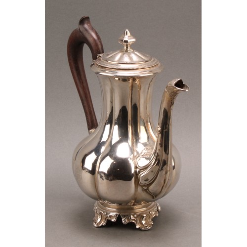 747 - A French silver fluted baluster teapot, hinged cover with knop finial, the spout chased with foliage... 