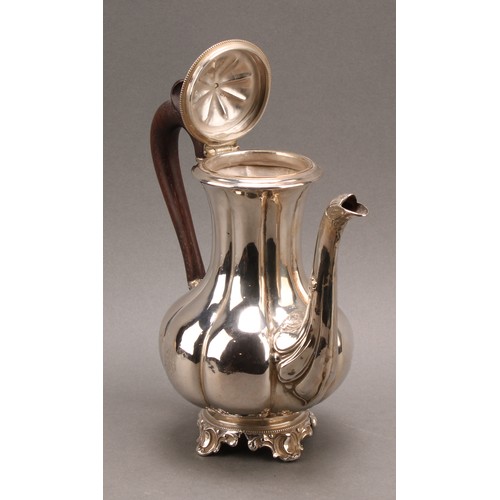 747 - A French silver fluted baluster teapot, hinged cover with knop finial, the spout chased with foliage... 