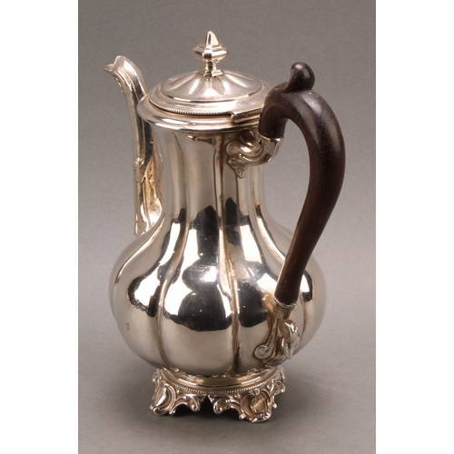 747 - A French silver fluted baluster teapot, hinged cover with knop finial, the spout chased with foliage... 