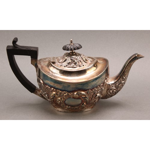 845 - A late Victorian Rococo Revival silver three-piece tea service, comprising teapot, sugar basin and c... 