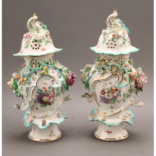 187 - A pair of Derby patch mark rococo style pedestal vases and covers, painted in polychrome with fancif... 