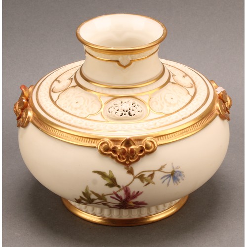 109 - A Royal Worcester reticulated pot pourri vase, decorated with floral sprigs, on a blush ivory ground... 