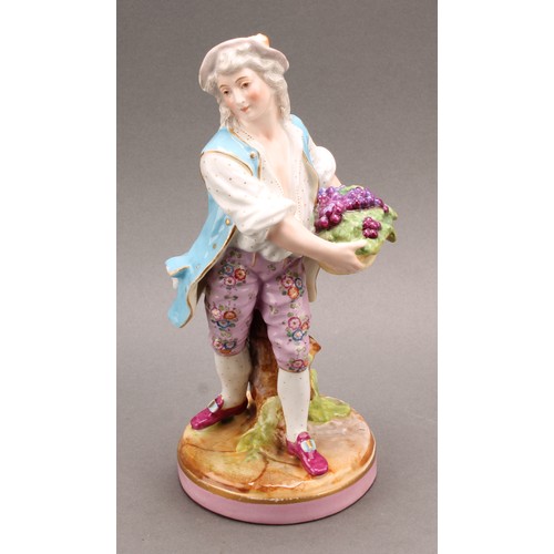 254 - A pair of German porcelain figures, as a grape farmer and his female companion, each carrying a bask... 