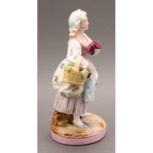 254 - A pair of German porcelain figures, as a grape farmer and his female companion, each carrying a bask... 