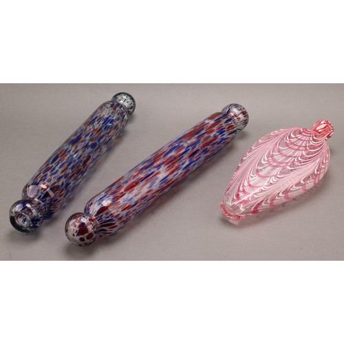 291 - A pair of 19th century Nailsea glass rolling pins, in mottled red and blue, 34cm long, the other 38c... 