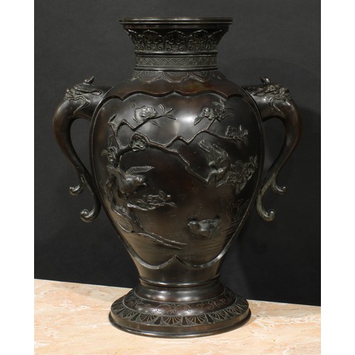 2080 - A large Japanese Meiji period bronze vase, of footed ovoid form, applied with paradise flycatchers a... 