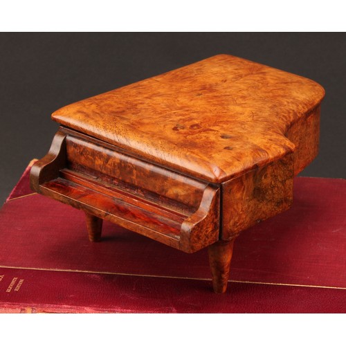 2339 - An early 20th century burr walnut novelty musical table vesta, as a grand piano, hinged cover enclos... 