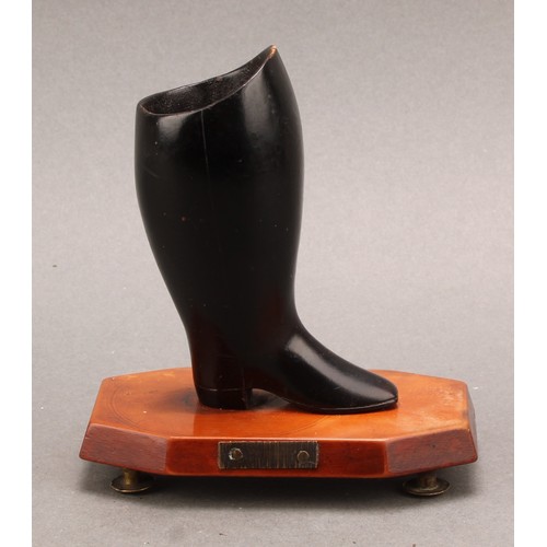 2210 - A 19th century novelty table vesta, as a boot, canted rectangular base with striker to frieze, brass... 