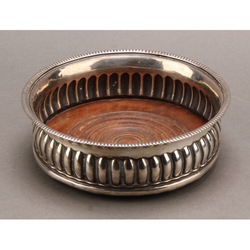 776 - A George III silver fluted circular wine coaster, gadrooned rim, 14.5cm diam, John Roberts & Co, She... 