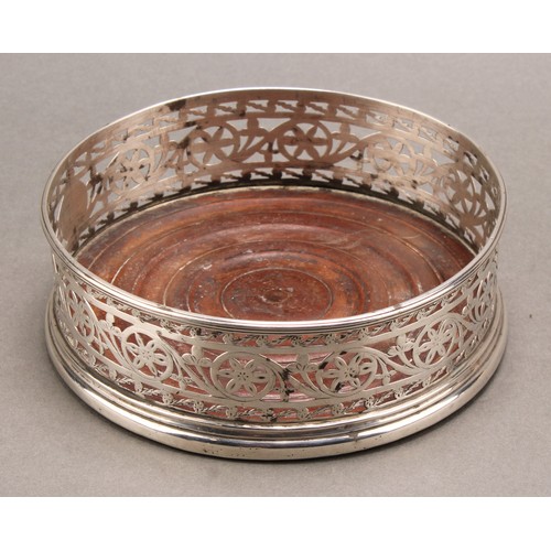 765 - A George III Irish silver circular wine coaster, pierced and bright-cut engraved in the Neo-Classica... 