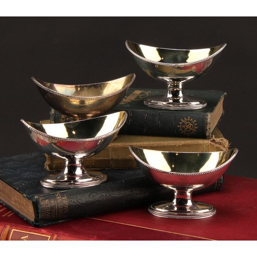 1134 - The Bateman Family - a set of four George III silver navette shaped pedestal salts, beaded borders, ... 