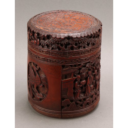 1373 - A pair of Chinese export bamboo tea caddies, each carved with narrative scenes with figures in a lan... 