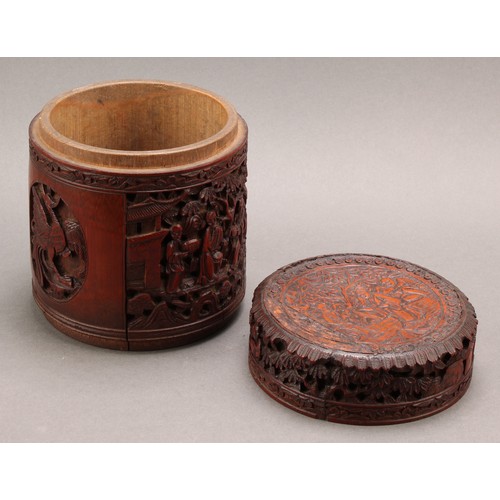 1373 - A pair of Chinese export bamboo tea caddies, each carved with narrative scenes with figures in a lan... 