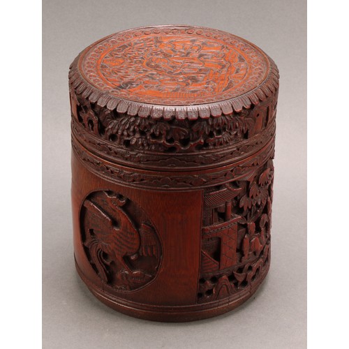 1373 - A pair of Chinese export bamboo tea caddies, each carved with narrative scenes with figures in a lan... 