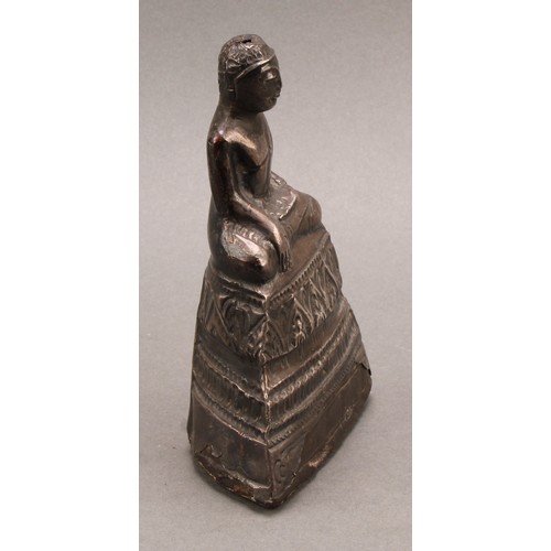 1276 - A Burmese silver coloured metal clad Buddha, typically seated in meditation, 14.5cm high