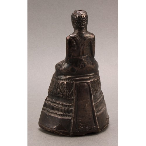 1276 - A Burmese silver coloured metal clad Buddha, typically seated in meditation, 14.5cm high