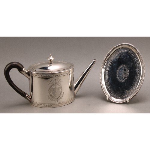 782 - A George III silver oval teapot and stand, hinged domed cover with urnular finial, bright-cut engrav... 