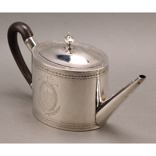 782 - A George III silver oval teapot and stand, hinged domed cover with urnular finial, bright-cut engrav... 