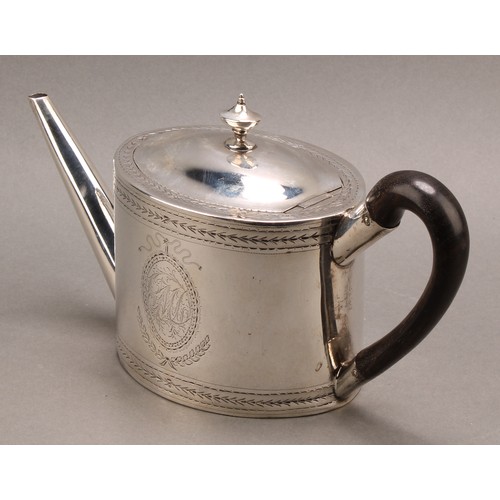 782 - A George III silver oval teapot and stand, hinged domed cover with urnular finial, bright-cut engrav... 