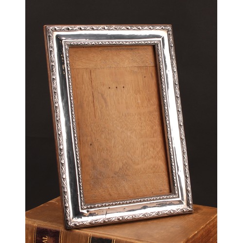 843 - A large George V silver rectangular easel photograph frame, 34cm high, Birmingham 1911