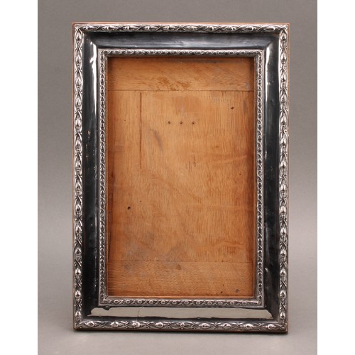 843 - A large George V silver rectangular easel photograph frame, 34cm high, Birmingham 1911