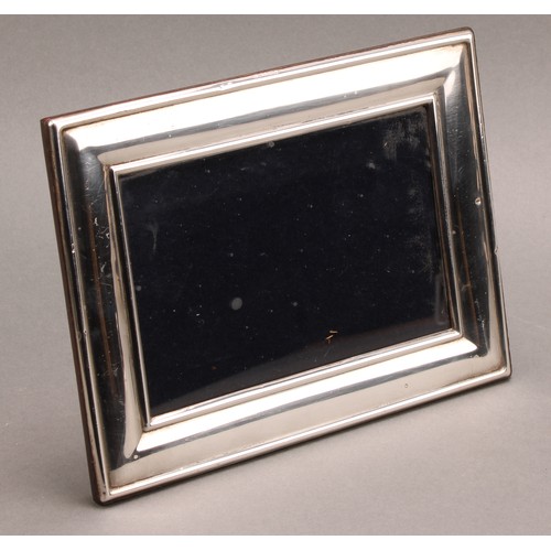 1057 - An Elizabeth II silver rectangular easel photograph frame, quite plain, 20cm high, Sheffield 2001