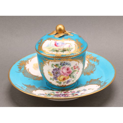 268 - A Sevres porcelain chocolate cup and cover, with stand, painted in polychrome, the cup and cover wit... 