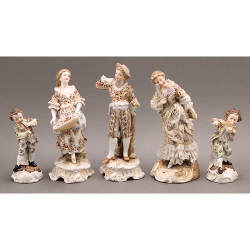 261 - A pair of Volkstedt porcelain figures, of a boy and his companion, their costume decorated with flow... 