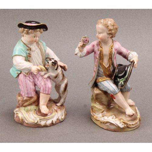 241 - A Meissen porcelain figure, of a boy feeding a dog, painted in polychrome, picked out with gilt, cir... 