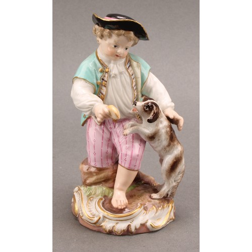 241 - A Meissen porcelain figure, of a boy feeding a dog, painted in polychrome, picked out with gilt, cir... 