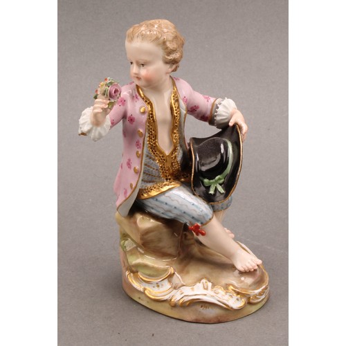 241 - A Meissen porcelain figure, of a boy feeding a dog, painted in polychrome, picked out with gilt, cir... 