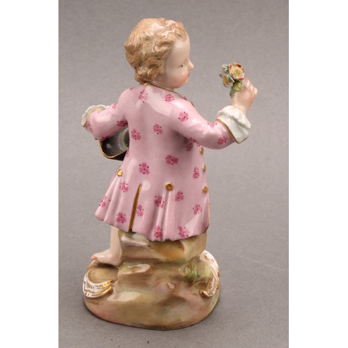 241 - A Meissen porcelain figure, of a boy feeding a dog, painted in polychrome, picked out with gilt, cir... 