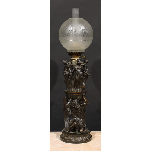 2481 - A substantial 19th century Renaissance Revival dark patinated bronze table oil lamp, cast with the k... 