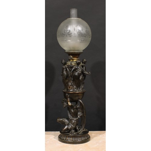 2481 - A substantial 19th century Renaissance Revival dark patinated bronze table oil lamp, cast with the k... 