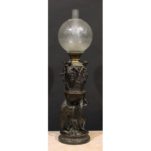 2481 - A substantial 19th century Renaissance Revival dark patinated bronze table oil lamp, cast with the k... 