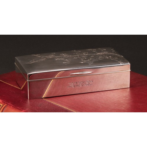 834 - A Japanese silver rectangular cigarette box, hinged cover engraved with blossoming prunus, 15.5cm wi... 