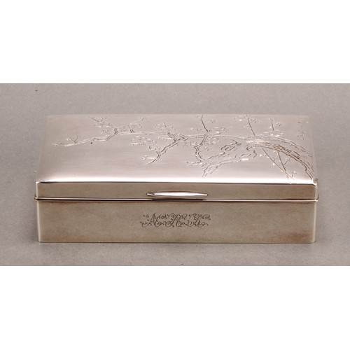 834 - A Japanese silver rectangular cigarette box, hinged cover engraved with blossoming prunus, 15.5cm wi... 