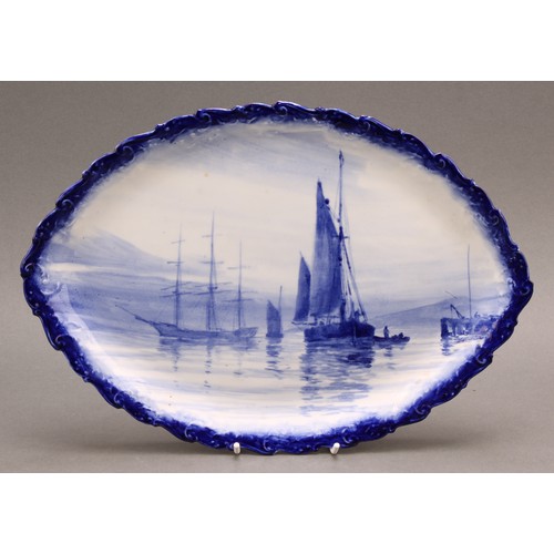 198 - A Royal Crown Derby navette shaped dish, painted in the manner of W.E.J. Dean, in tones of blue with... 