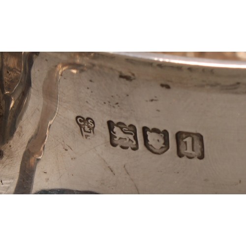 973 - A William & Mary style silver porringer and cover, chased with fruiting foliage, scroll handles cres... 