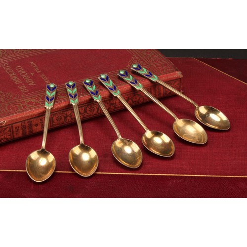 910 - A set of six Art Deco silver-gilt and enamel coffee spoons, Birmingham 1950, cased