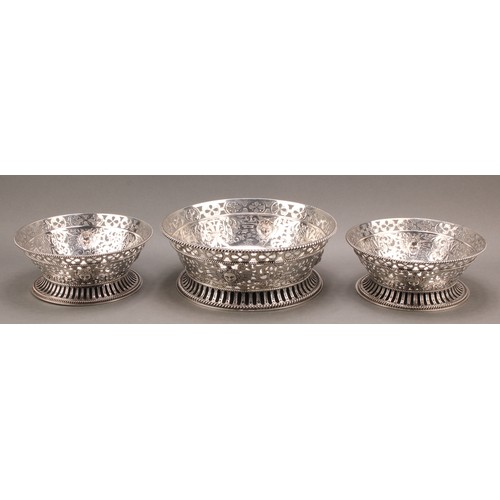 750 - A garniture of three George V silver fruit or table centre dishes, pierced and chased in the 18th ce... 